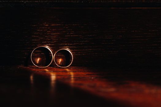 Close-up of two gold wedding rings for a wedding.