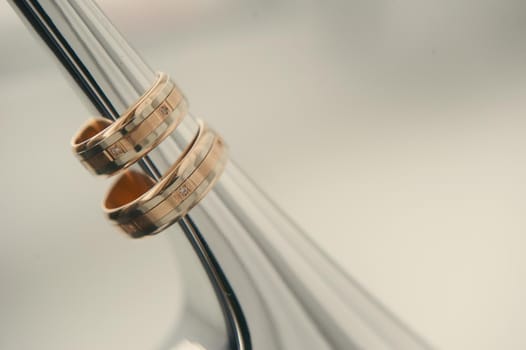 Close-up of two gold wedding rings for a wedding.