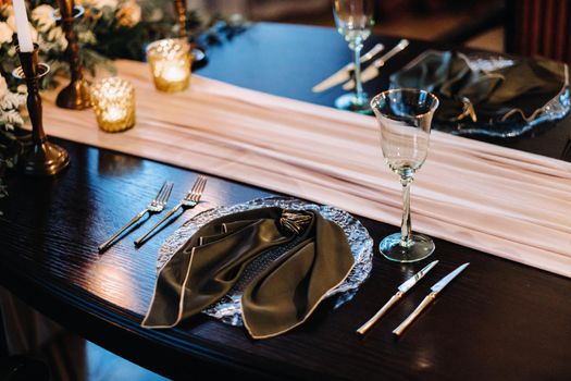 wedding table decoration on the table in the castle, Cutlery on the table.