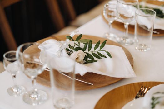 wedding table decoration with flowers on the table in the castle, table decor for dinner by candlelight.Dinner with candles.