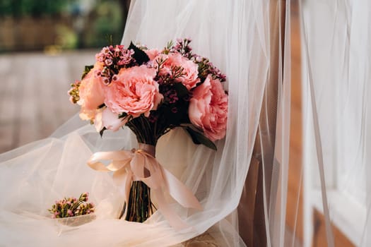 wedding bouquet with roses and boutonniere.The decor at the wedding.