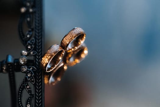 Close-up of two gold wedding rings for a wedding.