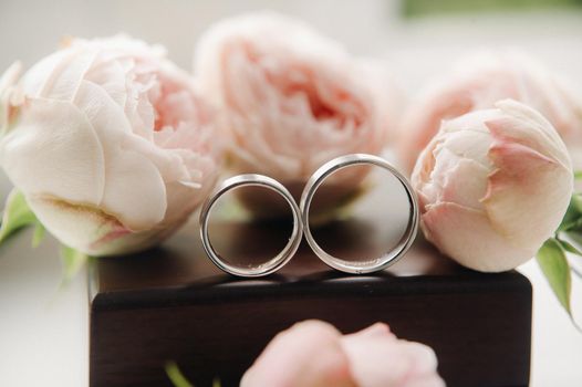 Close-up of two gold wedding rings for a wedding.