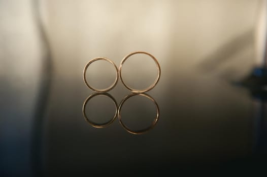 Close-up of two gold wedding rings for a wedding.