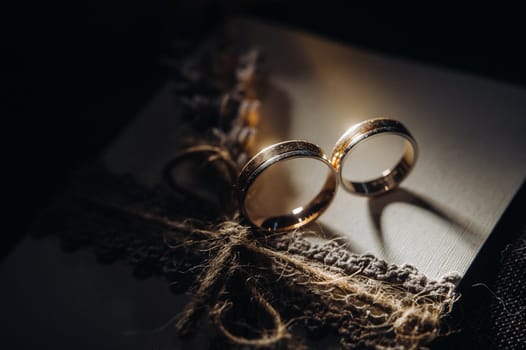 Close-up of two gold wedding rings for a wedding.