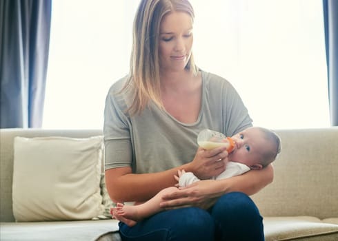 I handle her with complete care. a young mother and her baby at home