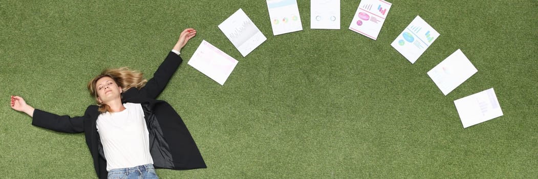 Woman is lying on green lawn along with chart business analytics. Advertising business banner place for text