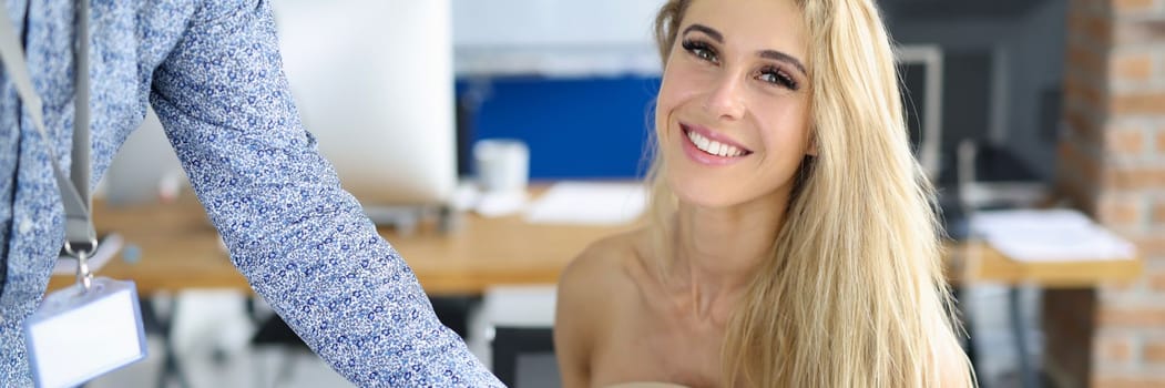 Man gives bio to interviewer at job interview. Partner brought business document to businesswoman