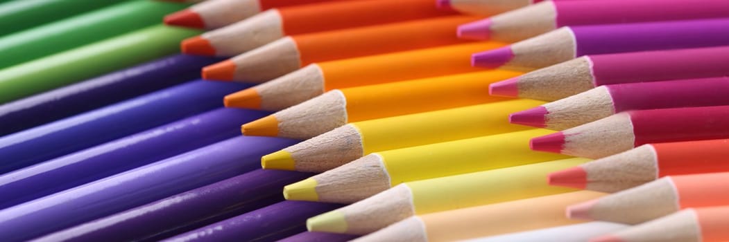 Colored pencils closeup. Collection of colored pencils in row concept