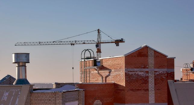 construction site and sunset in winter, structural steel beam builds large residential buildings on the construction site.