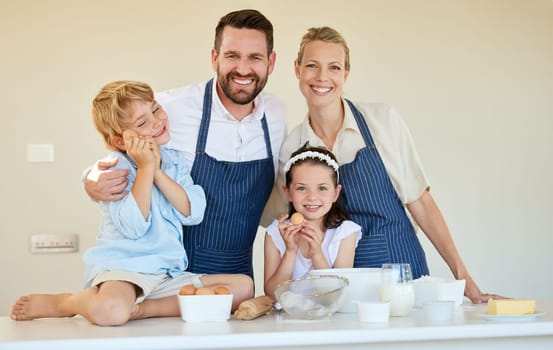 Its a family baking day. a young family cooking together at home