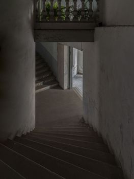 Bangkok, Thailand - Feb 09, 2023 - Old cement staircase and wall Interior an abandoned the old residential house building was left to deteriorate over time. Space for text, No focus, specifically.