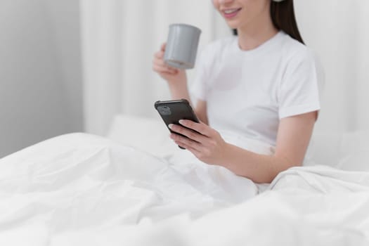 Portrait of Good Healthy woman drinking tea and resting in bed at bedroom. Lifestyle at home concept.