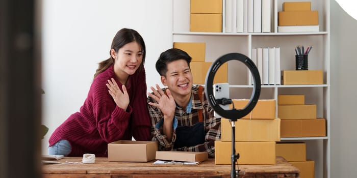 Asian couple doing business online. Entrepreneurs, small SME businesses concept