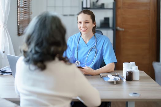 Portrait of a female doctor holding tablet computer to discuss and analyze the patient's condition before treating