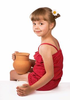 Little girl and milk isolated on white background