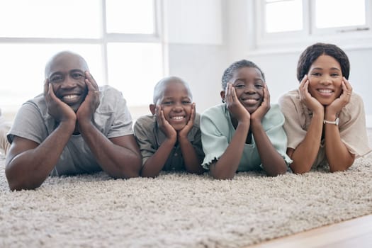 Ohana means family and family means nobody gets left behind. a family laying on the floor and bonding at home