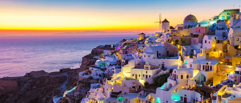 sunset by the ocean of Oia Santorini Greece, a traditional Greek village in Santorini with whitewashed churches and blue domes
