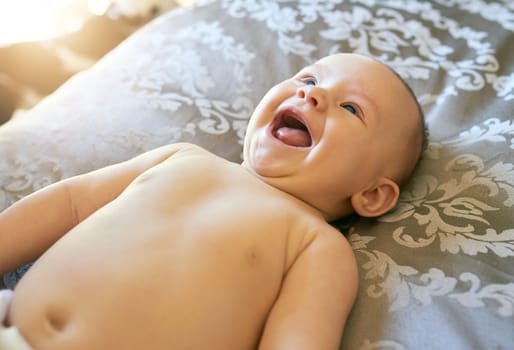 Precious laughter. an adorable baby girl at home