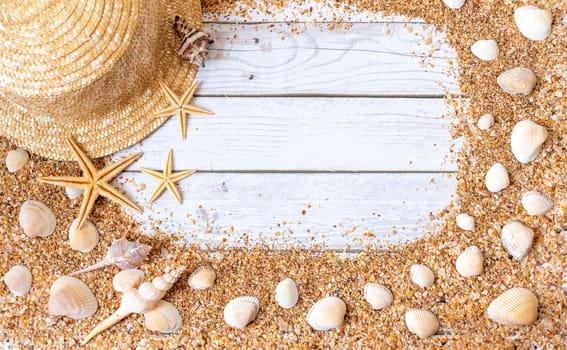 Sand seashells background. Summer time concept with sea shells and starfish on wooden background and sand.