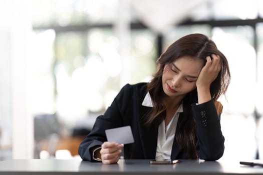 Stress, credit card or business woman with laptop confused with finance, burnout or budget depression in office. Document, bill or employee with headache for loan payment decline.