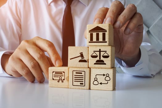 Lawyer holds cubes about business law.