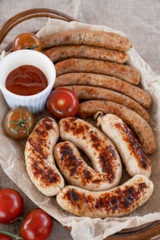Grilled sausages with sauce and vegetables. Summer rest concept