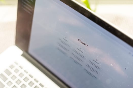 Mobile phone with website of US artificial intelligence company OpenAI LLC on screen in front of business logo. Focus on top-left of phone display. Kyiv, Ukraine - February 08, 2023. High quality photo