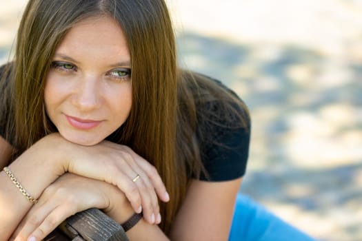Close-up portrait of a beautiful girl of Slavic appearance, the girl has a thoughtful look a