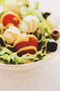 Food and diet, salad with fresh vegetables and mozzarella cheese as meal for lunch or dinner, tasty recipe idea