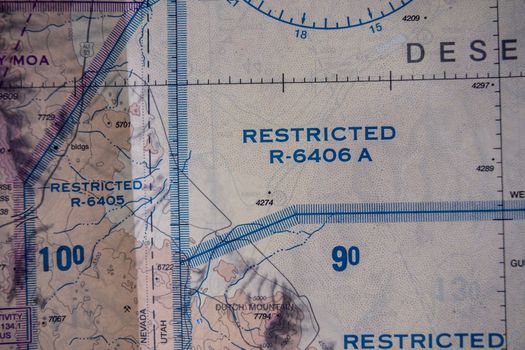 Close up detail of FAA sectional map showing restricted airspace national security flight regulations. High quality photo