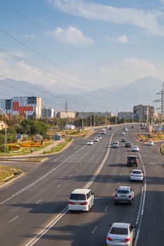 Vertical View of the new sleeping areas of the city of Almaty, Momyshuly street, leaving towards the mountains. Almaty, Kazakhstan - September 24, 2022