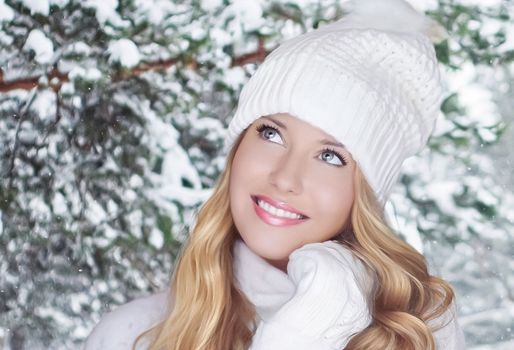 Winter holiday travel, lifestyle and fashion, beautiful happy woman and snowy forest, nature, ski resort and leisure activity outdoors Christmas, New Year and holidays portrait.