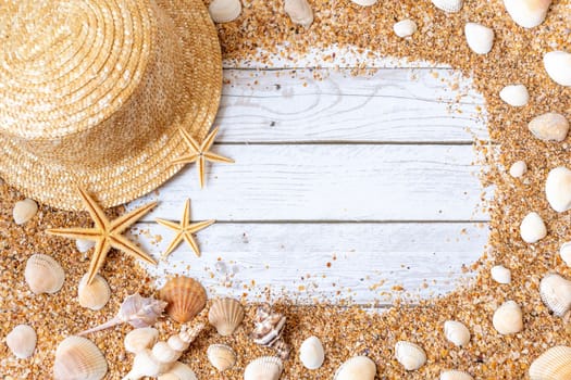 Sand seashells background. Summer time concept with sea shells and starfish on wooden background and sand.