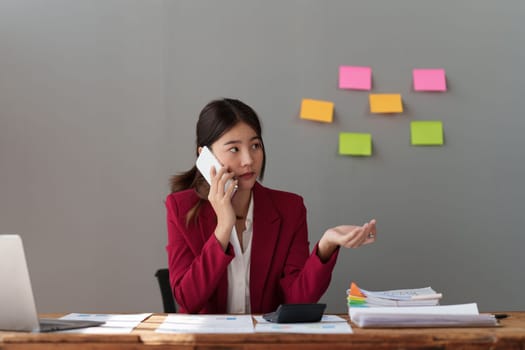 Beautiful business woman talking on the mobile phone. Management, planning and networking phone call concept