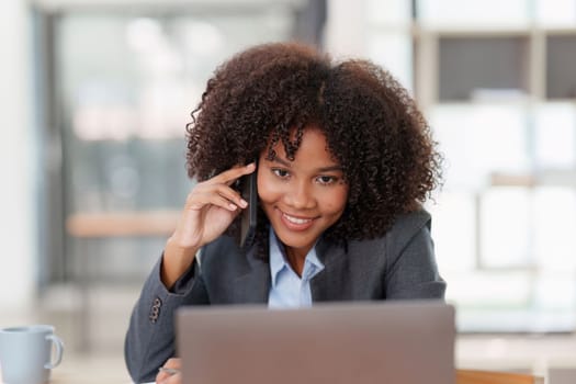 American african business woman talking on the mobile phone. Management, planning and networking phone call concept