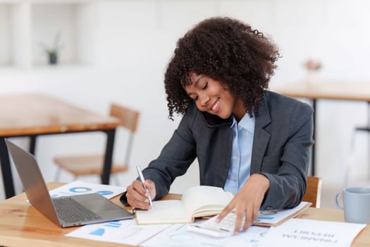 American african business woman talking on the mobile phone. Management, planning and networking phone call concept