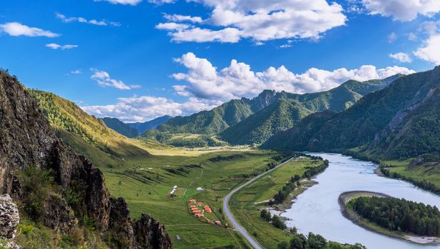 Colorful view of the mountains and the Katun River, with an island in the Altai Mountains, Siberia, Russia. View from the observation deck in the mountains. The concept tourism