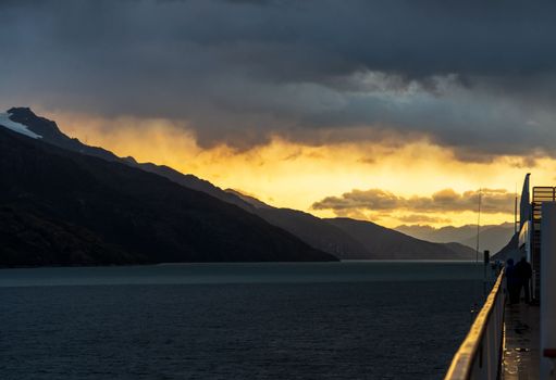 Cruise ship sailing between mountains in Glacier Alley of Beagle channel in Chile