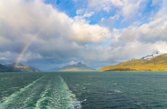 Panorama of Glacier Alley of Beagle channel in Chile from cruise ship with rainbow