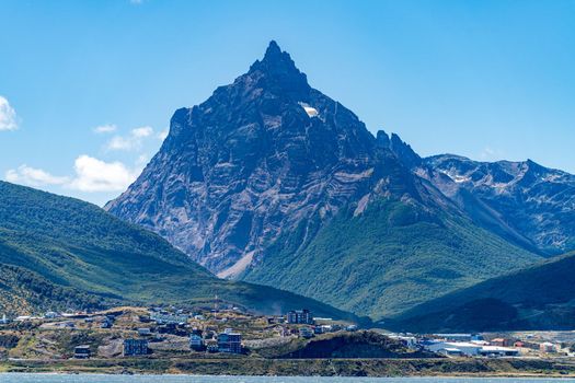 Buildings of the city of Ushuaia in Patagonia Argentina under the snow mountains
