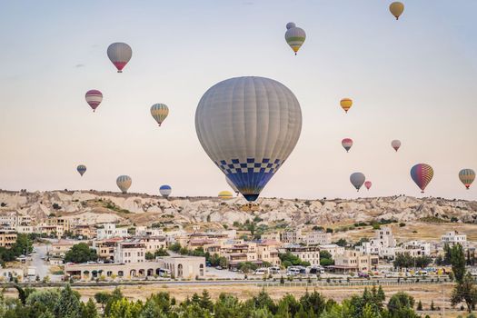 Colorful hot air balloon flying over Cappadocia, Turkey.