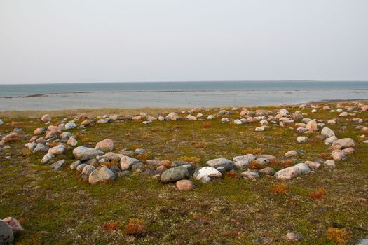 Remains of Inuit tent ring along the coast of Hudson Bay north of Arviat at a place called Qikiqtarjuq, Nunavut, Canada