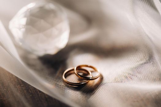 Close-up of two gold wedding rings for a wedding.