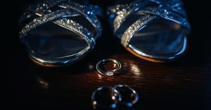 Close-up of two gold wedding rings in a black background.Wedding ring.Wedding rings.