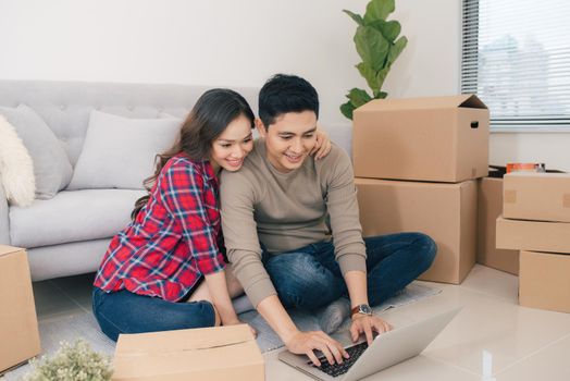 Young loving couple moving to a new house. Home and family concept.