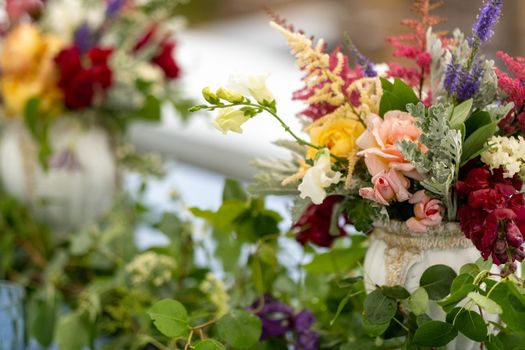 wedding table decoration with flowers on the table in the castle, table decor for dinner by candlelight.Dinner with candles.