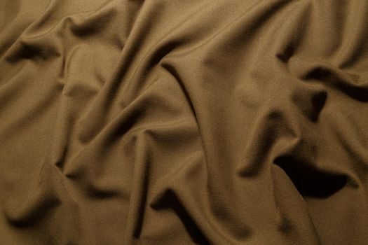 crumpled khaki tan crumpled tan khaki canvas fabric - full frame background and texture.