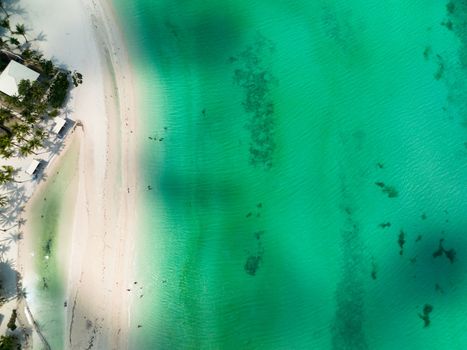 Beautiful sandy beach with palm trees and sea with waves. Bantayan island, Philippines.