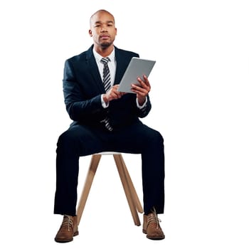 Using technology the business way. Studio shot of a handsome young businessman using a tablet against a white background